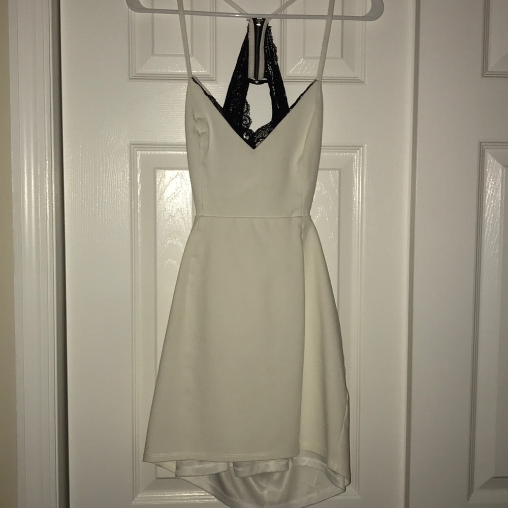 White dress with cutouts and black lace